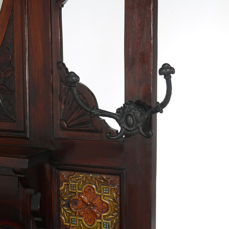 Antique Carved Mahogany Hall Tree with Decorative Tile And Mirror C1900