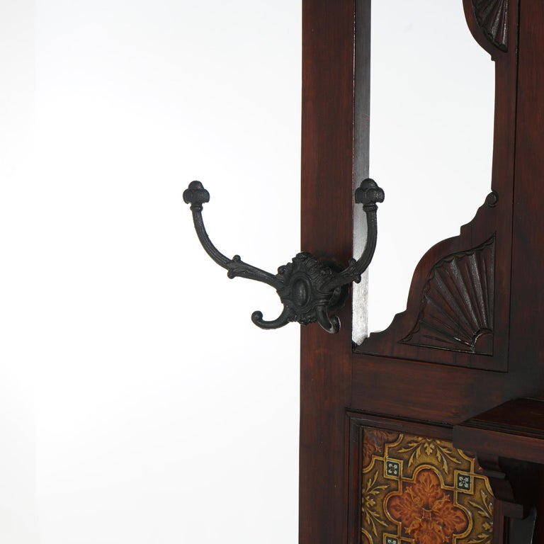 Antique Carved Mahogany Hall Tree with Decorative Tile And Mirror C1900