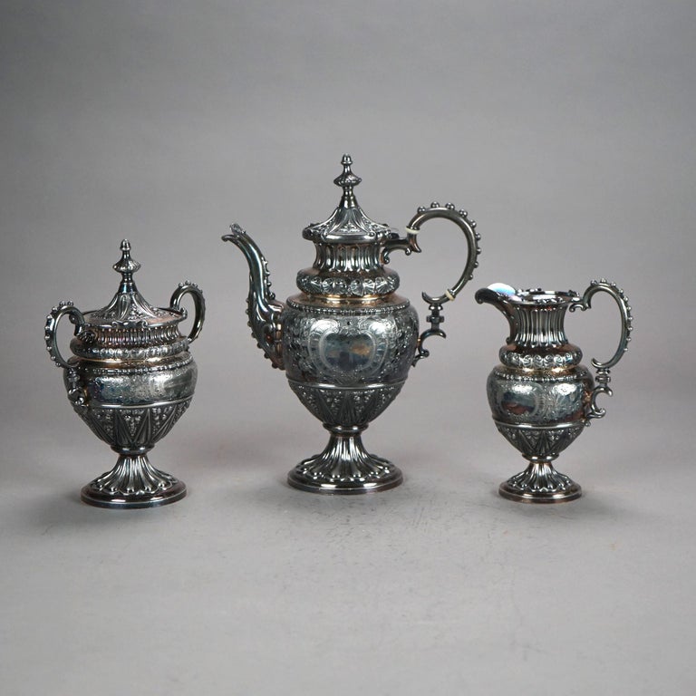 Three Piece Antique Silver Plated Tea Set with Foliate Engraving C1890