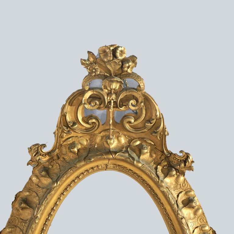 Oversized Gold Giltwood Oval Parlor Mirror with Foliate & Floral Crest C1890
