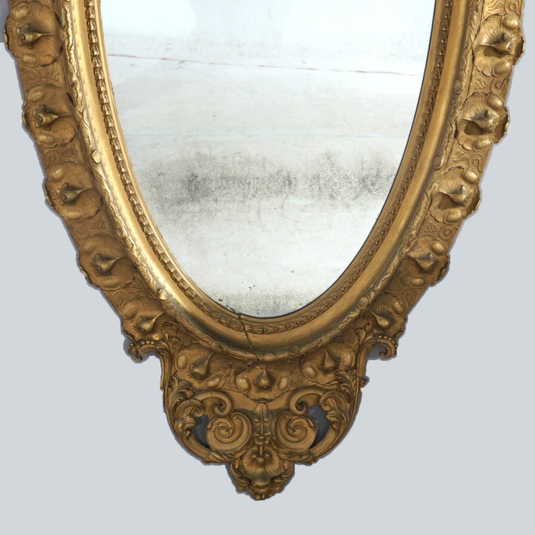Oversized Gold Giltwood Oval Parlor Mirror with Foliate & Floral Crest C1890
