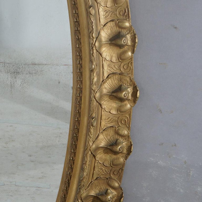 Oversized Gold Giltwood Oval Parlor Mirror with Foliate & Floral Crest C1890