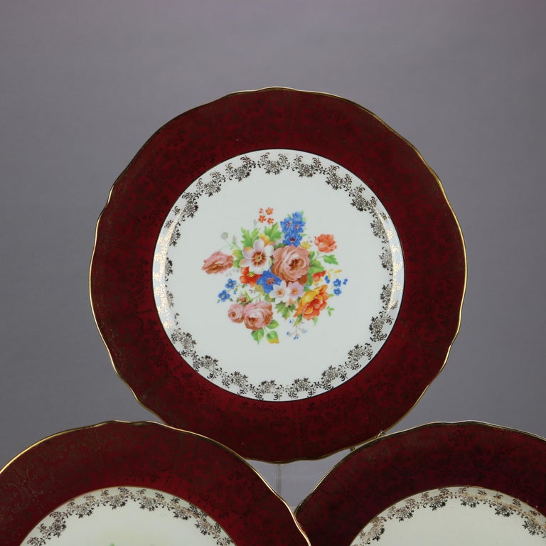 Six Atlas Burgundy & Gilt Rim China Dinner Plates with Floral Well