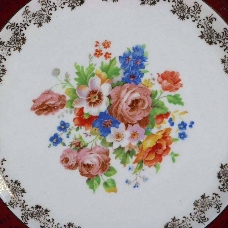 Six Atlas Burgundy & Gilt Rim China Dinner Plates with Floral Well