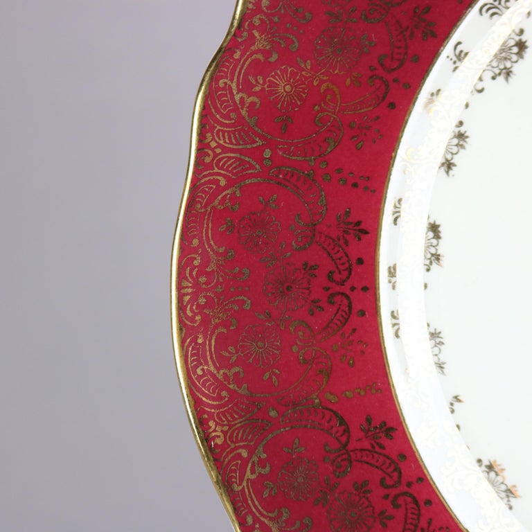 Six Atlas Burgundy & Gilt Rim China Dinner Plates with Floral Well