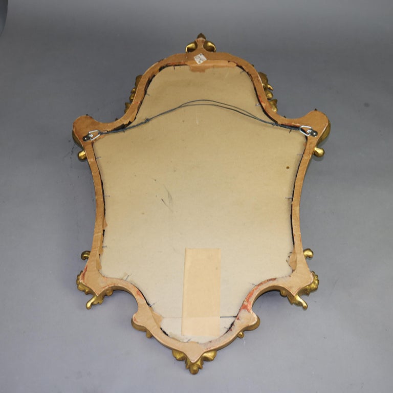Antique Louis XIV Style Giltwood Shield Form Mirror with Foliate Elements C1930