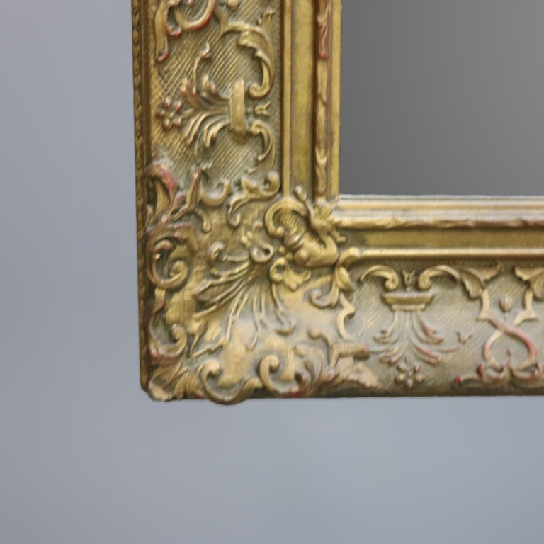 Antique Continental Scroll and Foliate Giltwood Framed Wall Mirror, circa 1900