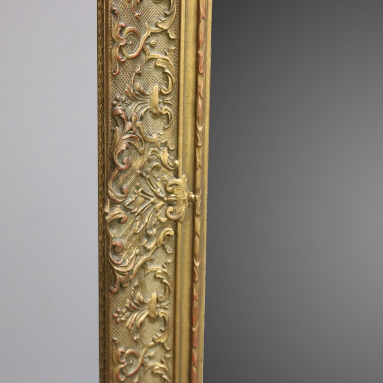 Antique Continental Scroll and Foliate Giltwood Framed Wall Mirror, circa 1900
