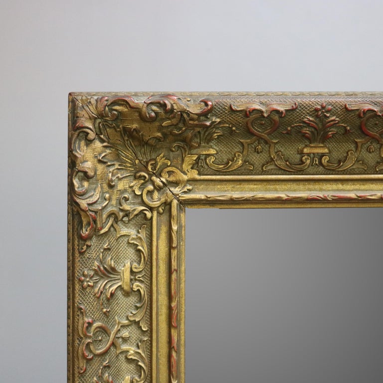 Antique Continental Scroll and Foliate Giltwood Framed Wall Mirror, circa 1900