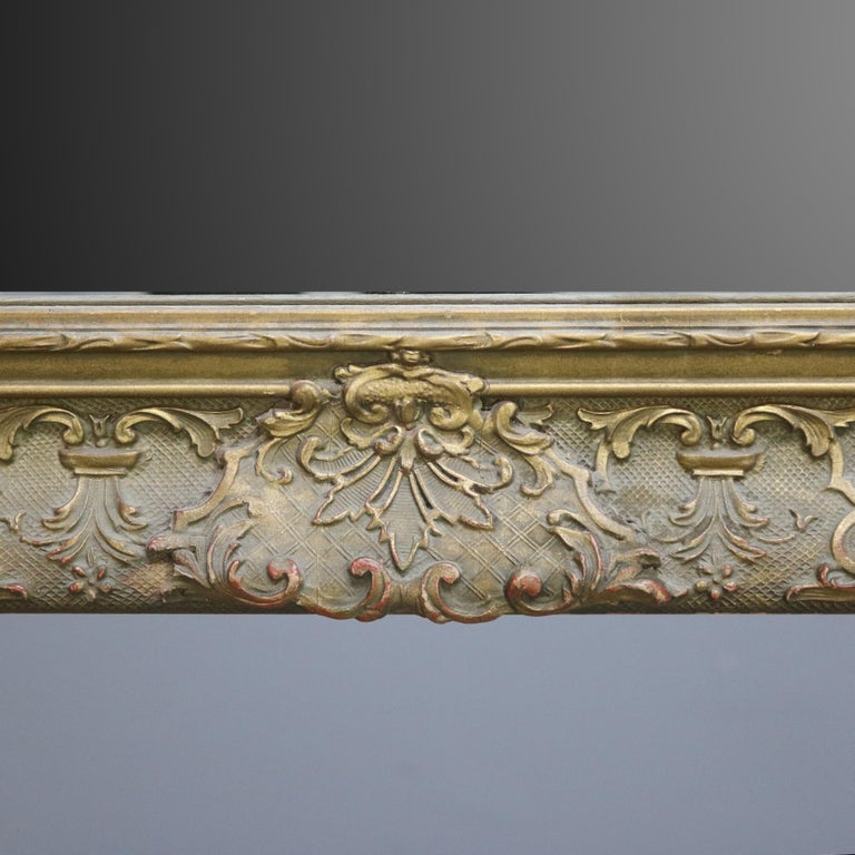 Antique Continental Scroll and Foliate Giltwood Framed Wall Mirror, circa 1900
