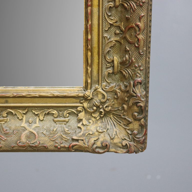 Antique Continental Scroll and Foliate Giltwood Framed Wall Mirror, circa 1900
