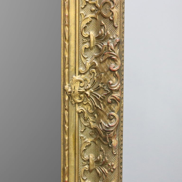 Antique Continental Scroll and Foliate Giltwood Framed Wall Mirror, circa 1900