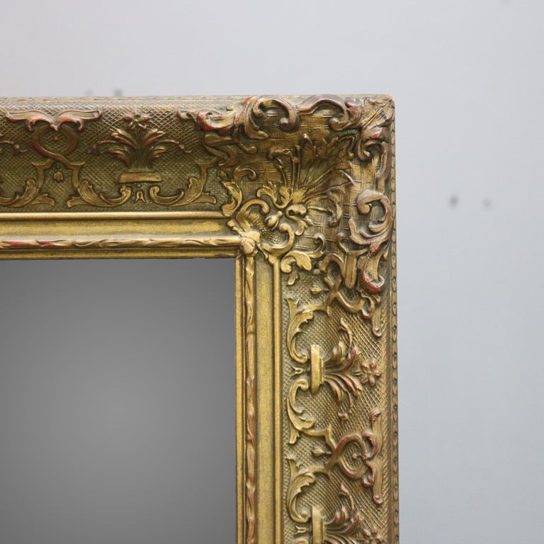 Antique Continental Scroll and Foliate Giltwood Framed Wall Mirror, circa 1900
