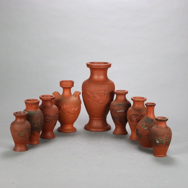 Nine Japanese Embossed Terra Cotta Vases C1930