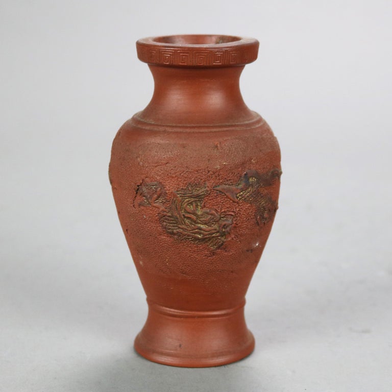 Nine Japanese Embossed Terra Cotta Vases C1930