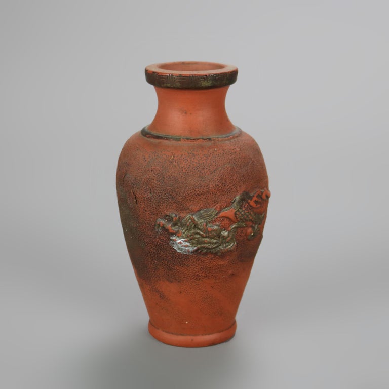 Nine Japanese Embossed Terra Cotta Vases C1930