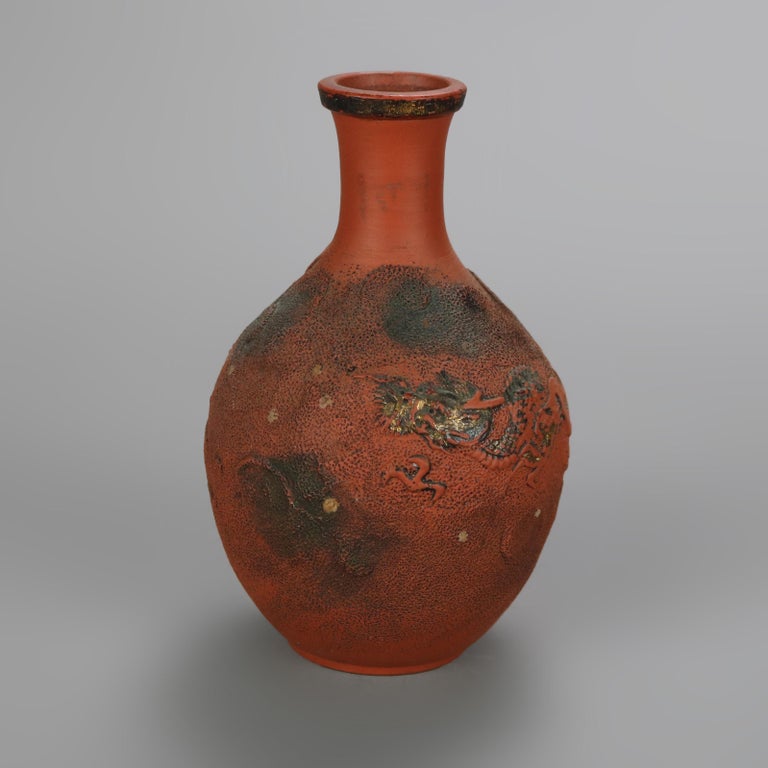 Nine Japanese Embossed Terra Cotta Vases C1930
