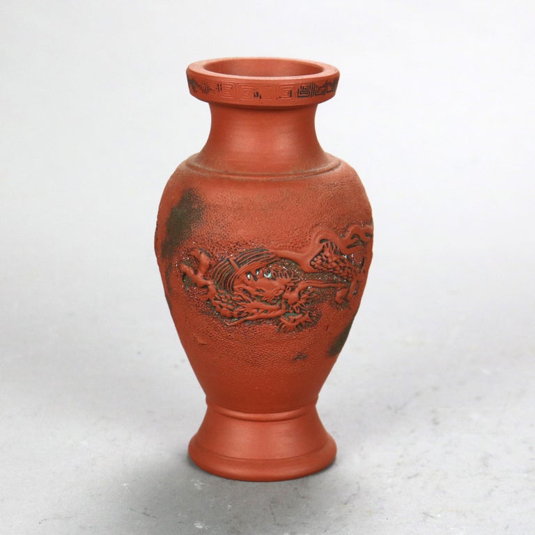 Nine Japanese Embossed Terra Cotta Vases C1930