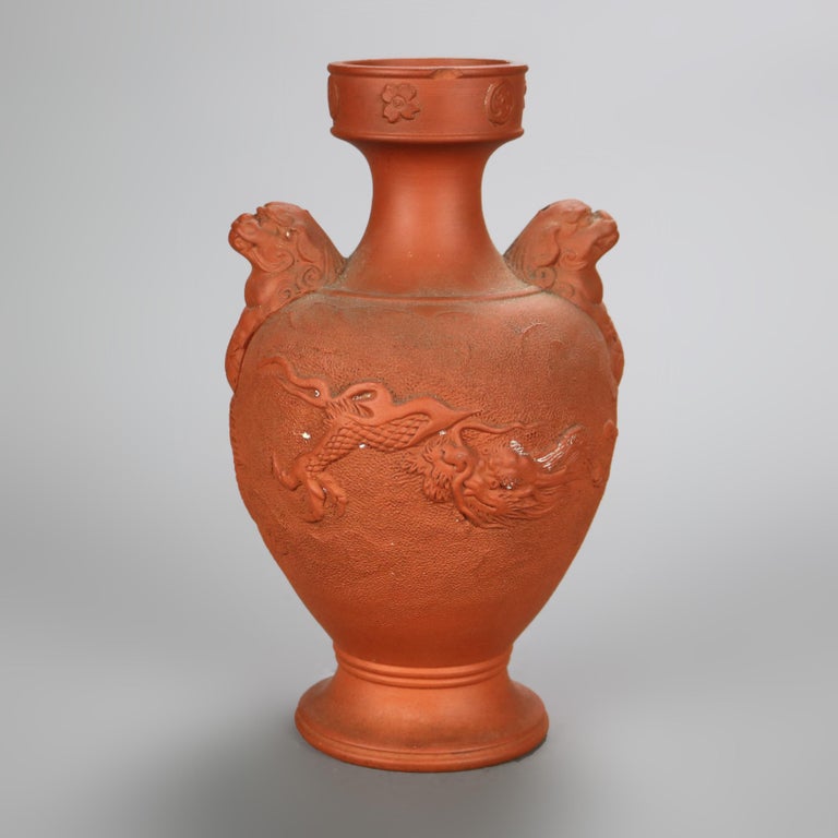 Nine Japanese Embossed Terra Cotta Vases C1930