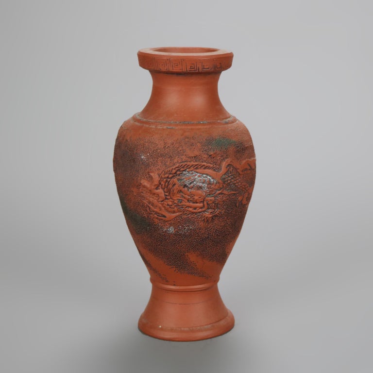 Nine Japanese Embossed Terra Cotta Vases C1930